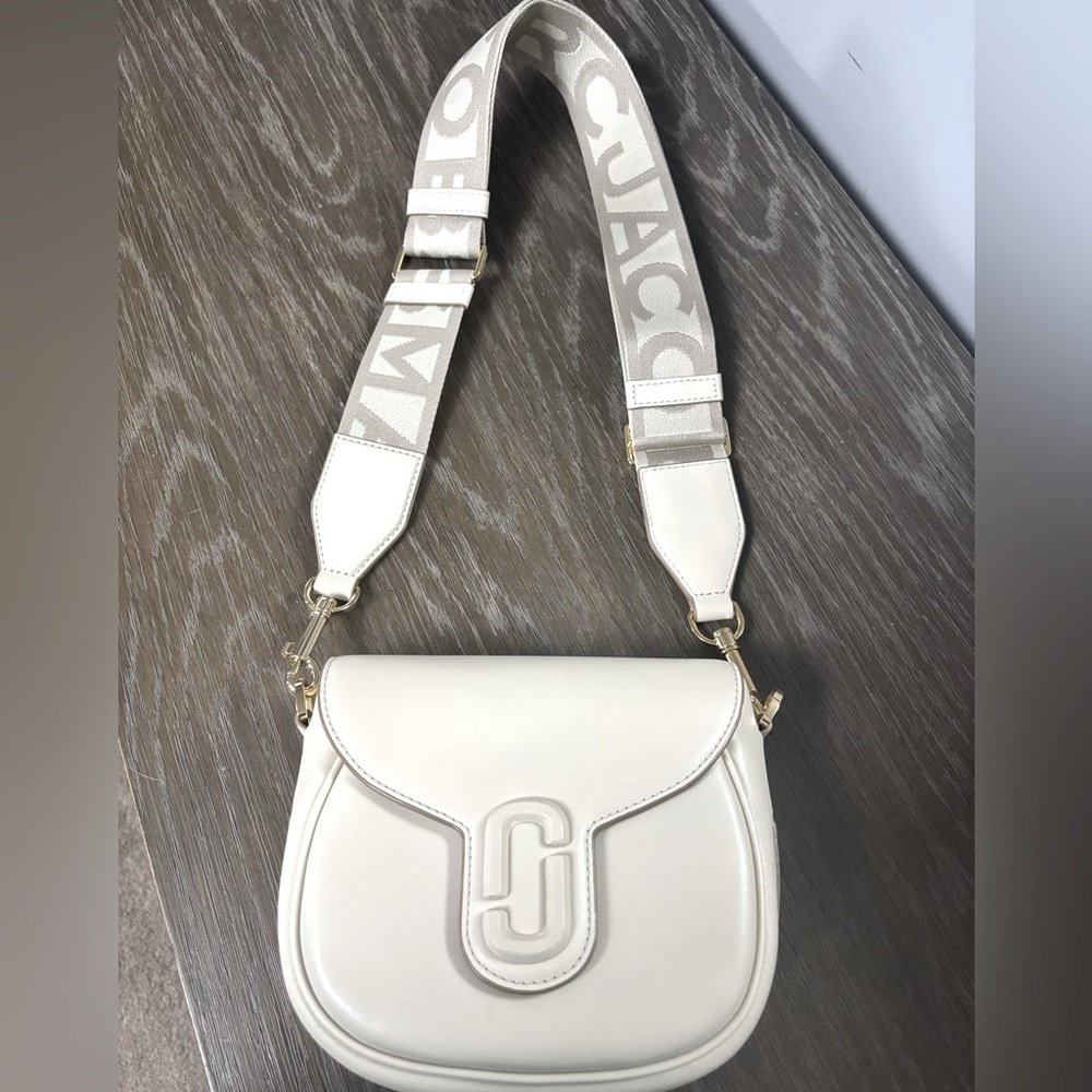 Marc Jacobs “The Covered J Marc Saddle Bag”